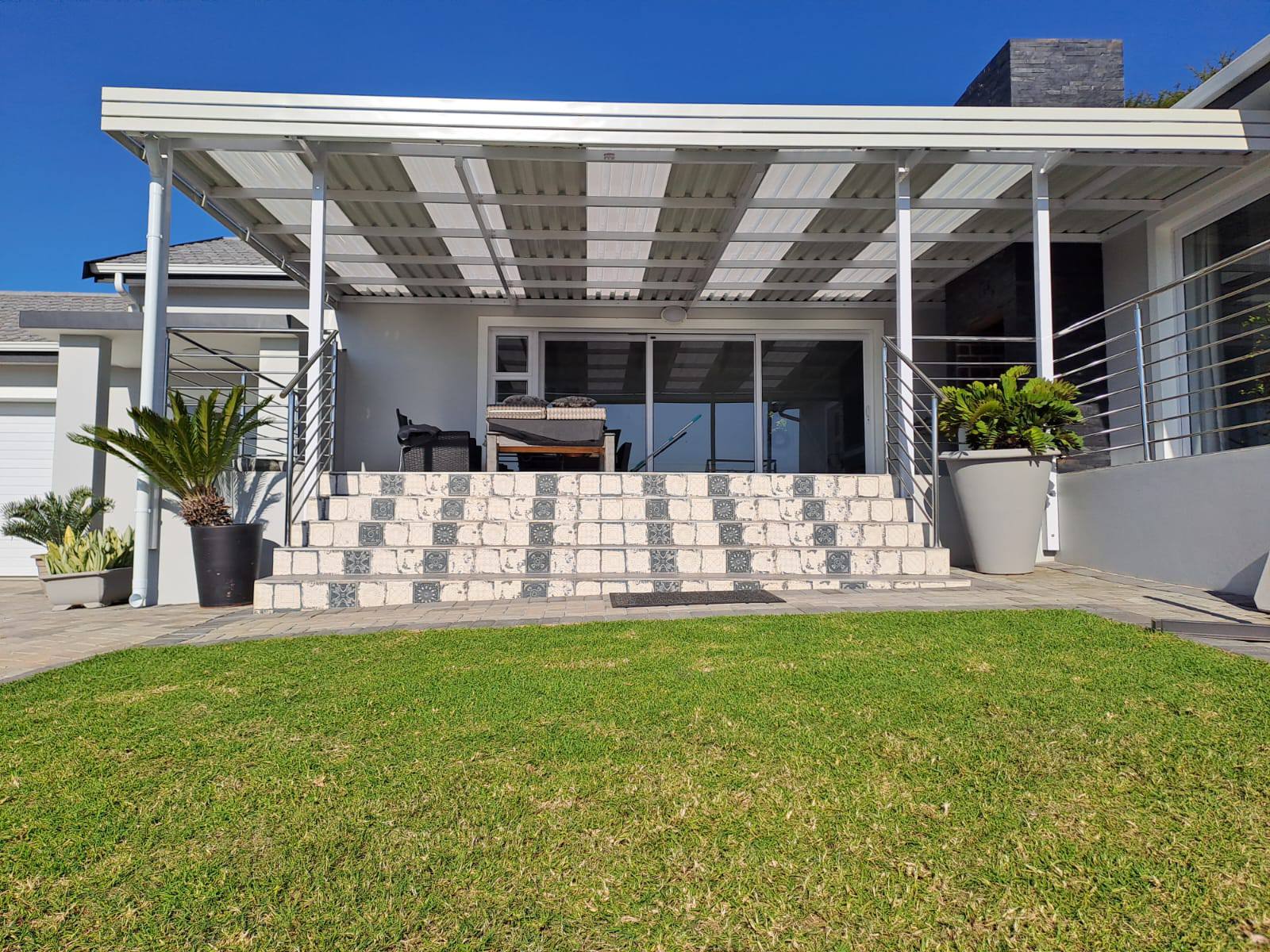 Louvred aluminium patio cover installed by 4 Seasons Awnings & Blinds in Jeffreys Bay